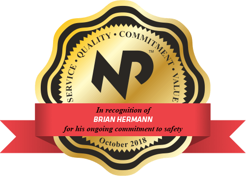 a gold and black seal that says "in recognition of Brian Hermann for his ongoing commitment to safety"